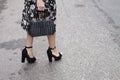 A woman showing off her high heels and Handbag Royalty Free Stock Photo