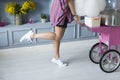 A woman showing off her legs with one foot up in the air. Royalty Free Stock Photo