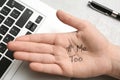 Woman showing palm with hashtag METOO at laptop on grey background. Stop sexual assault