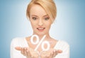 Woman showing sign of percent in her hands Royalty Free Stock Photo