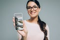 woman showing smartphone with app for tickets