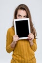 Woman showing tablet computer screen Royalty Free Stock Photo