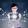 Woman showing tablet with currency symbols Royalty Free Stock Photo