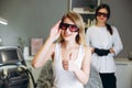 Woman showing thumb up before getting laser treatment on her body in a beauty salon Royalty Free Stock Photo