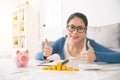 Woman showing thumbs up after counting Royalty Free Stock Photo