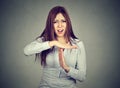 Woman showing time out hand gesture frustrated screaming to stop Royalty Free Stock Photo