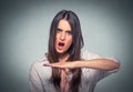 Woman showing time out hand gesture, frustrated screaming to stop Royalty Free Stock Photo