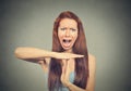 Woman showing time out hand gesture, frustrated screaming Royalty Free Stock Photo