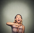 Woman showing time out hand gesture, frustrated screaming Royalty Free Stock Photo