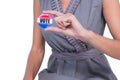 A Woman showing vote badge