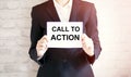 Woman showing white card with CALL TO ACTION word . Business Royalty Free Stock Photo