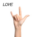 Woman showing word Love on white background. Sign language