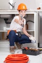 Woman showing a wrench Royalty Free Stock Photo