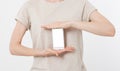 Woman shows blank display of mobile phone, hand points to device, blank screen cellular Royalty Free Stock Photo