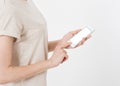 Woman shows blank display of mobile phone, hand points to device, blank screen cellular Royalty Free Stock Photo