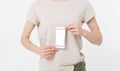 Woman shows blank display of mobile phone, hand points to device, blank screen cellular Royalty Free Stock Photo