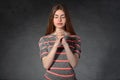 Woman shows calmness against a dark background