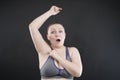 Unhappy woman shows her unshaved armpit. plus size middle age woman is not happy with hair in her armpits. Caucasian girl is Royalty Free Stock Photo