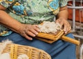 Woman shows how to card wool