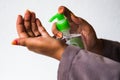 Woman shows how to use liquid alcohol-based sanitizer with hand. General procedures for washing hands for use in epidemics or Royalty Free Stock Photo