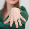 Woman shows new ring with blue gem Royalty Free Stock Photo