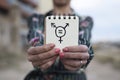 Woman shows notepad with a transgender symbol Royalty Free Stock Photo