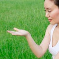 Woman shows something with her right hand