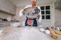 Woman sifting flour through sieve. Selective focus. Royalty Free Stock Photo