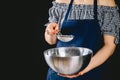 Woman sifting flour through sieve. Selective focus Royalty Free Stock Photo