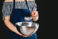 Woman sifting flour through sieve. Selective focus Royalty Free Stock Photo