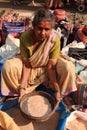 Woman sifting in a street market India