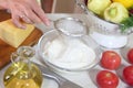 The woman sifts a flour Royalty Free Stock Photo