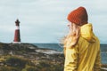 Woman sightseeing lighthouse sea landscape in Norway Travel Lifestyle concept scandinavian vacations outdoor