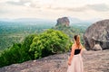 Woman in Sigiriya, Sri Lanka. Travel in beautiful nature. Mountain and forest landscape. Happy girl. Royalty Free Stock Photo