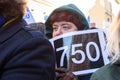 Woman with 750 sign euros at hands, during protest to pay rise for teachers in Latvia.