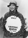 Woman with sign with number of shopping days until Christmas Royalty Free Stock Photo