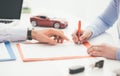 Driver signing a car insurance Royalty Free Stock Photo