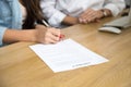 Woman signing contract, female hand putting written signature on Royalty Free Stock Photo