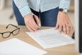 woman signing document in office Royalty Free Stock Photo