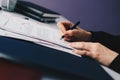 Woman signing last will and testament. Royalty Free Stock Photo