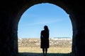 Woman silhouette on a ancient stone tunnel Royalty Free Stock Photo