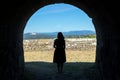 Woman silhouette on a ancient stone tunnel Royalty Free Stock Photo