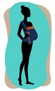 Woman silhouette with a baby in a blue ergo sling. Babywearing mother concept