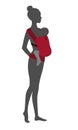 Woman silhouette with a baby in a red ergo sling. Babywearing mother concept