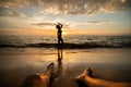 Woman silhouette on the beach at sunset with man Legs Royalty Free Stock Photo