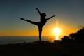 Woman silhouette dancing ballet at sunset