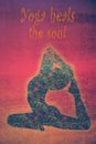 Woman silhouette in king pigeon yoga position with quote yoga heals the soul Royalty Free Stock Photo