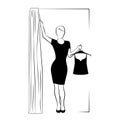 Woman silhouette in fitting room, modern shopping