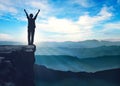 Mountain woman silhouette on top of rock, victory, success, freedom, fighting spirit Royalty Free Stock Photo