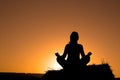 Woman silhouette making yoga